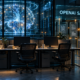 Editorial illustration of three empty AI research workstations beside a secured independent oversight checkpoint